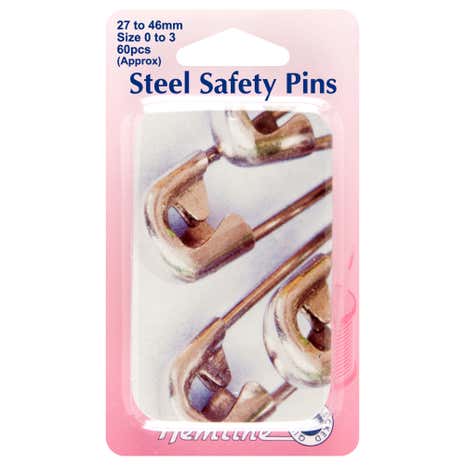 Assorted Sizes Of Safety Pins In A Tin