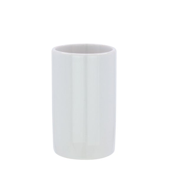 white ceramic tumbler