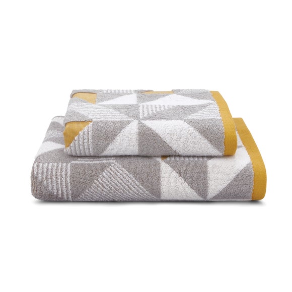 yellow and grey bath towels