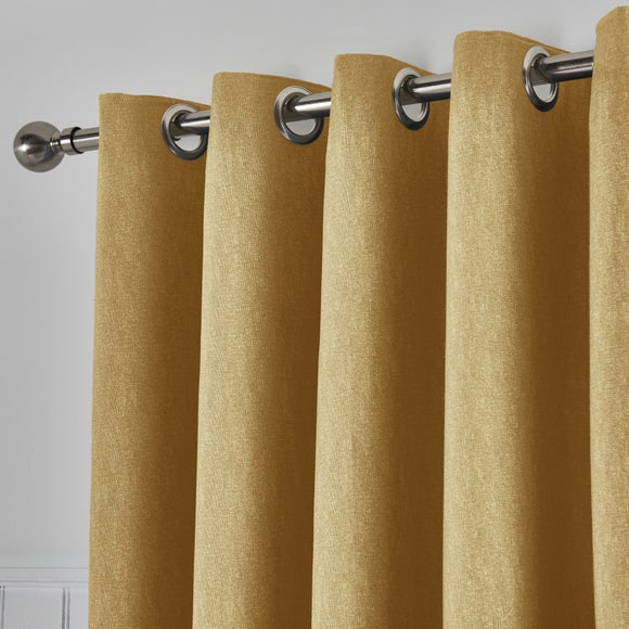 Tyla Ochre Blackout Eyelet Curtains | Dunelm