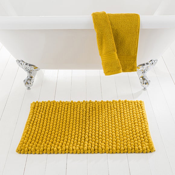 yellow towels and bath mats