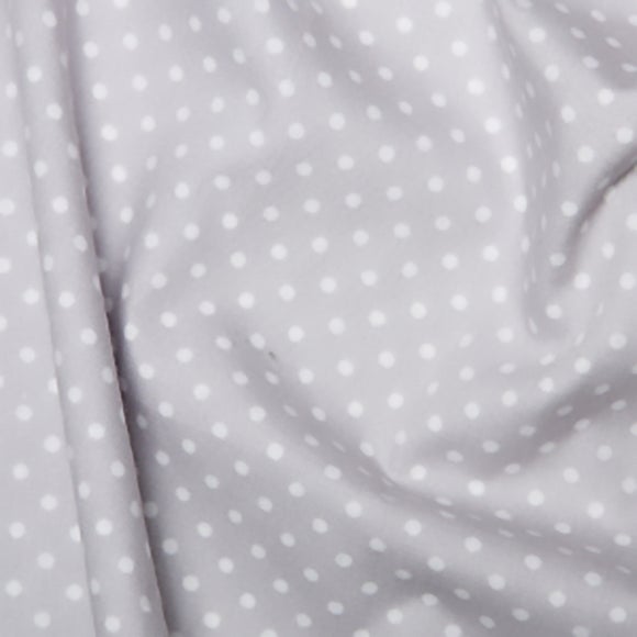 white fabric with polka dots