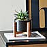 Black Pot on a Wooden Stand with Plant Black