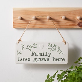 Family Love Grows Here Plaque