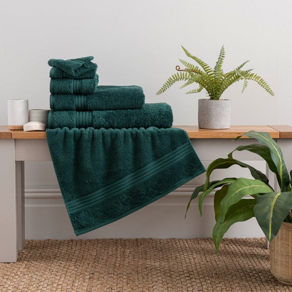 green bath mats and towels