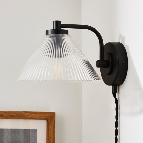 Click to view product details and reviews for Ezra Ribbed Glass Plug In Wall Light.