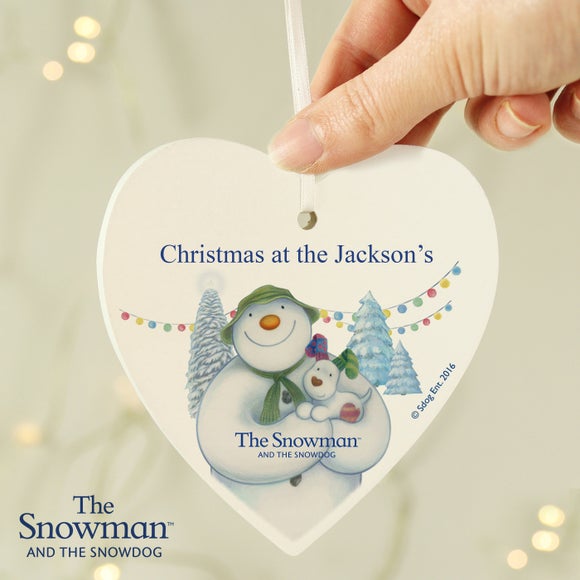 Click to view product details and reviews for Personalised The Snowman And The Snowdog Wooden Heart Decoration.