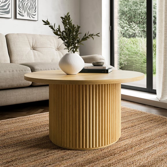 Click to view product details and reviews for Amari Round Coffee Table.