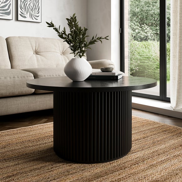 Click to view product details and reviews for Amari Round Coffee Table.