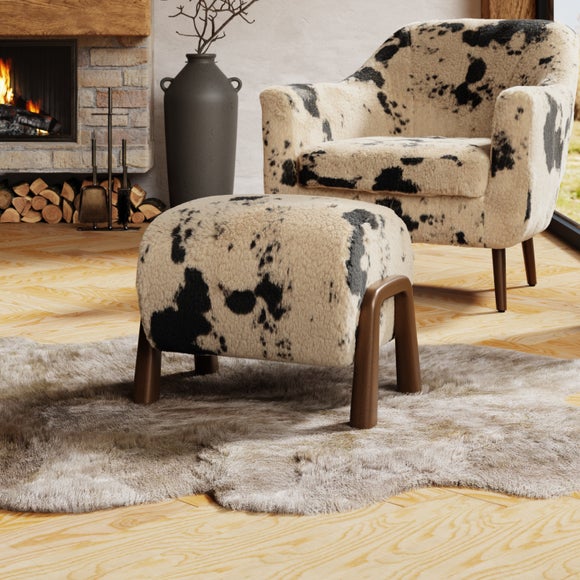 Click to view product details and reviews for Curved Cow Fur Wooden Accent Stool.
