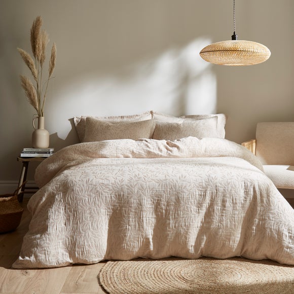 Click to view product details and reviews for Kingham Leaves Cream Duvet Cover And Pillowcase Set.