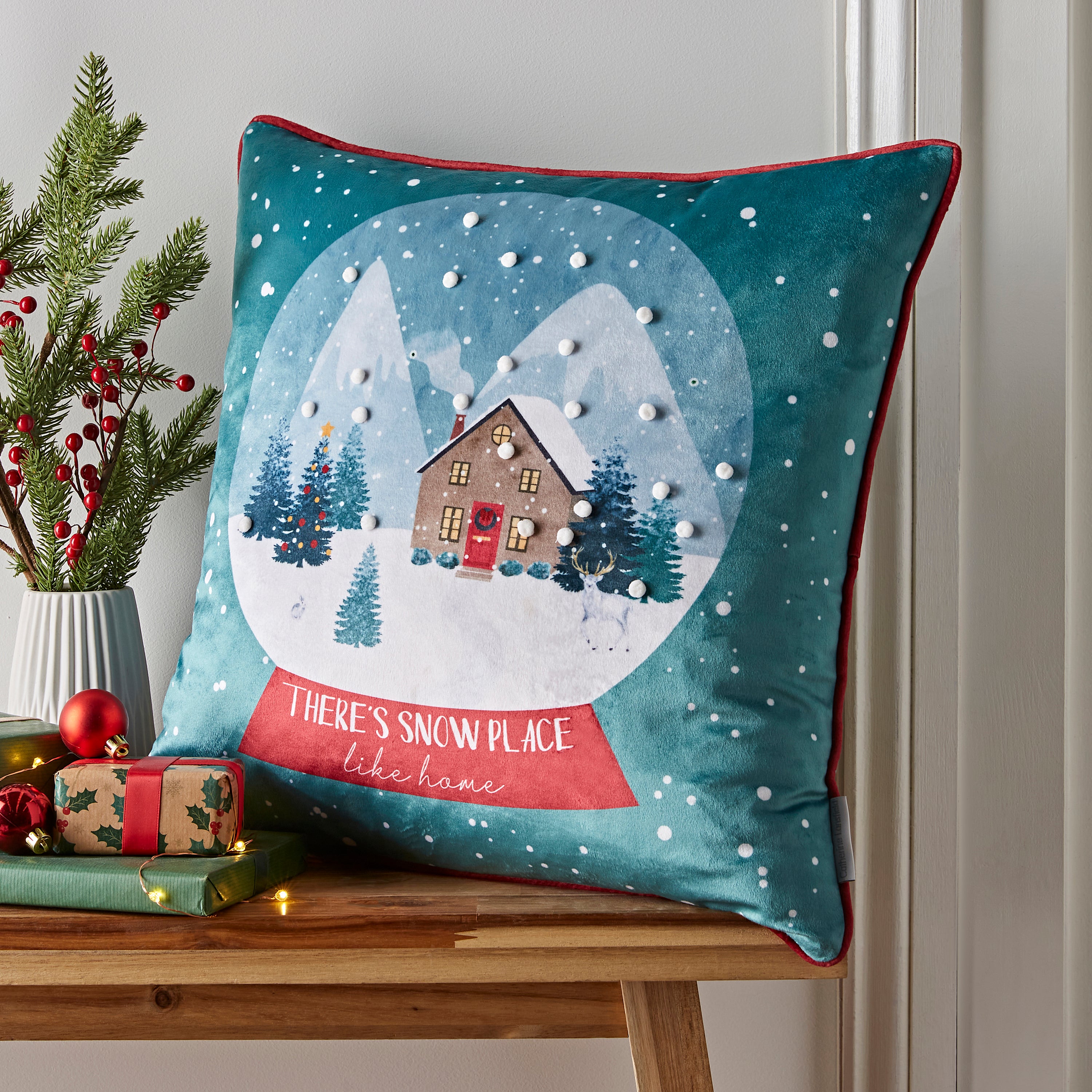 Catherine Lansfield Snow Place Like Home Pom Pom Cushion Green