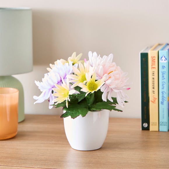 Click to view product details and reviews for Artificial Floral Arrangement In White Ceramic Plant Pot.