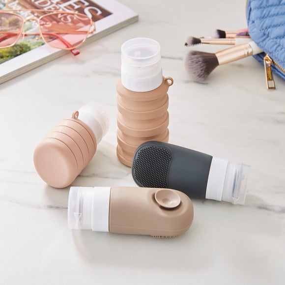 View Pack Of 4 Unio Travel Bottles With Bag View Pack Of 4 Unio Travel Bottles With Bag