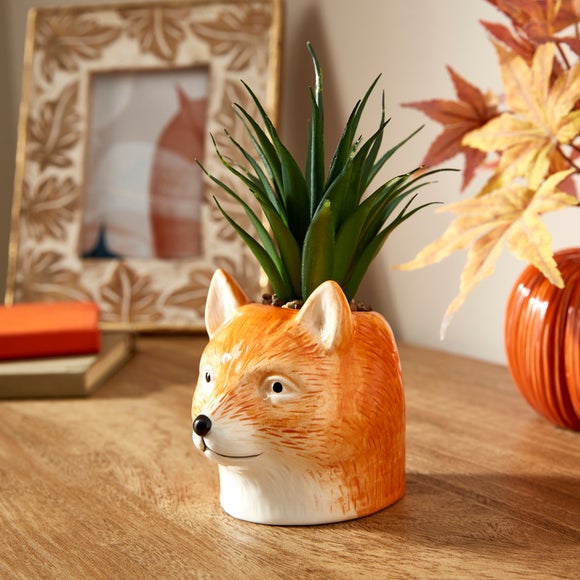 Click to view product details and reviews for Artificial Succulent In Ceramic Fox Plant Pot.