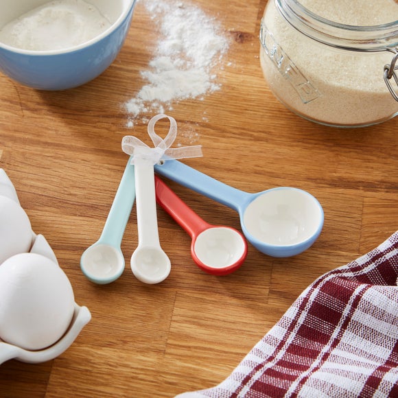 Click to view product details and reviews for Set Of 4 Stoneware Measuring Spoons.
