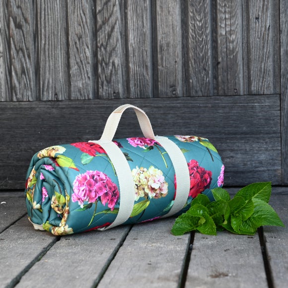 Click to view product details and reviews for Navigate Sarah Kelleher Teal Rose Print Quilted Picnic Blanket.