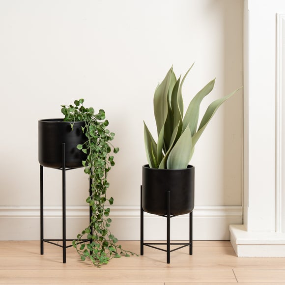 Click to view product details and reviews for Set Of 2 Metal Footed Plant Pots.