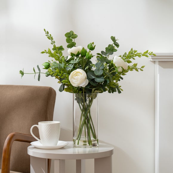 Click to view product details and reviews for Artificial Ranunculus Bouquet In Clear Glass Vase.