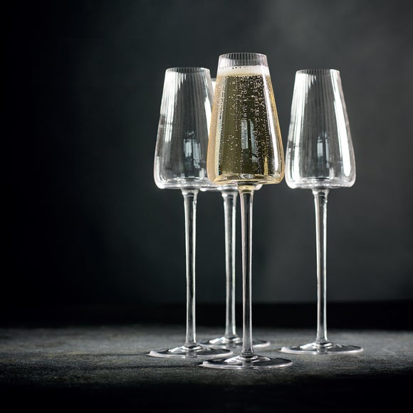 Click to view product details and reviews for Brooke Set Of 4 Ribbed Concave Champagne Flutes.