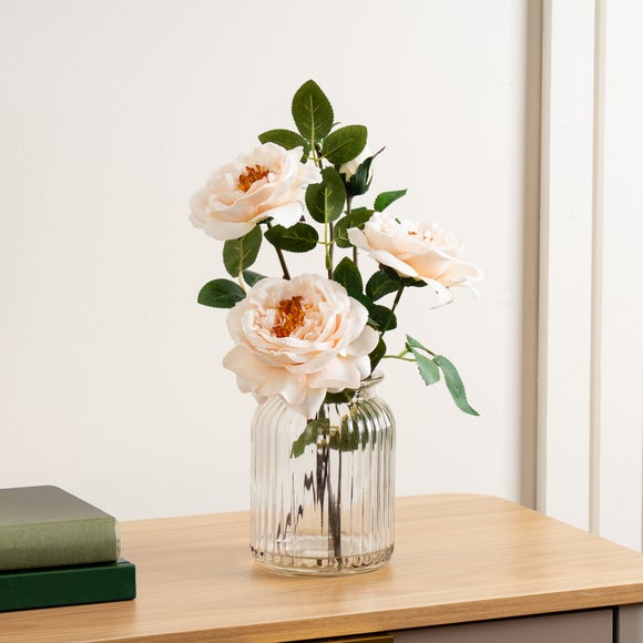 Click to view product details and reviews for Artificial Blush Pink Rose Arrangement In Ribbed Glass Vase.