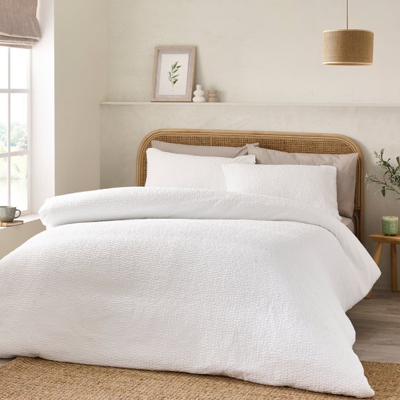 Click to view product details and reviews for Catherine Lansfield Crinkle Seersucker Duvet Cover Pillowcase Set.