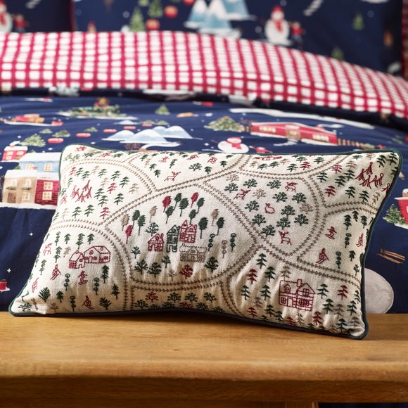 Click to view product details and reviews for Catherine Lansfield Christmas Ski Village Embroidered Rectangular Cushion.