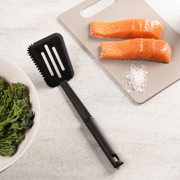Click to view product details and reviews for Handy Kitchen Slotted Turner With Serrated Edge.