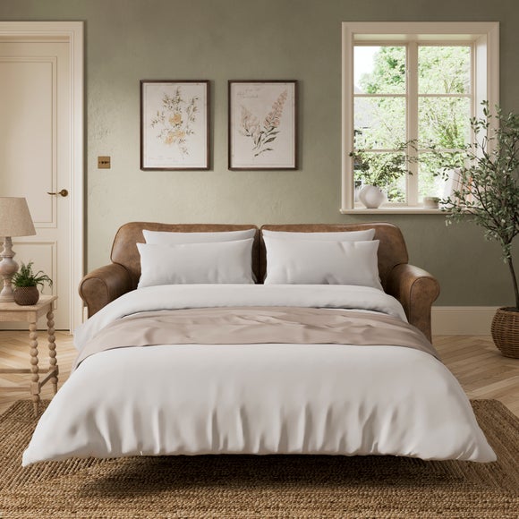 Click to view product details and reviews for Millie Soft Faux Leather 2 Seater Sofa Bed.