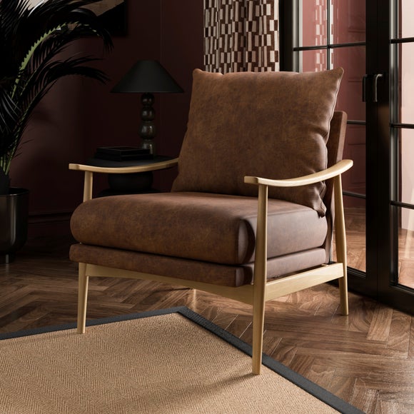 Click to view product details and reviews for Nelson Relaxed Faux Leather Occasional Armchair.