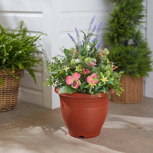 Click to view product details and reviews for Artificial Lavender And Pansy Arrangement.