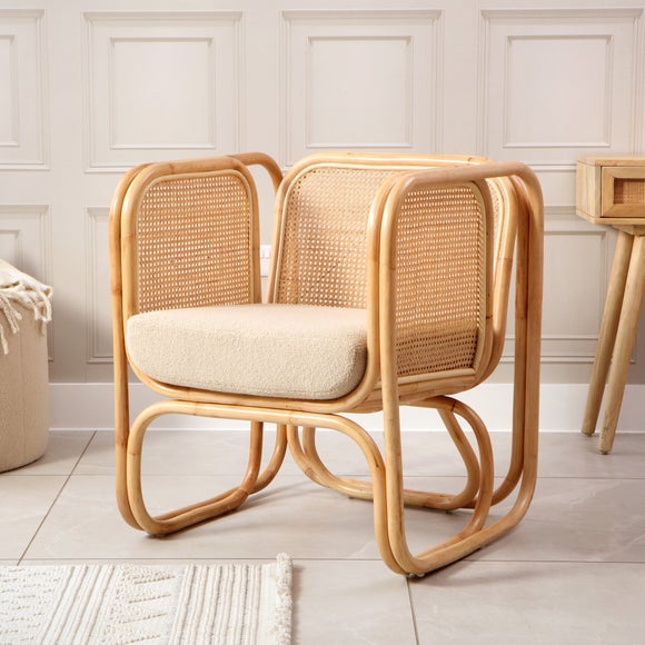 Click to view product details and reviews for Desser Iconic Rattan Chair With Boucle Cushion.