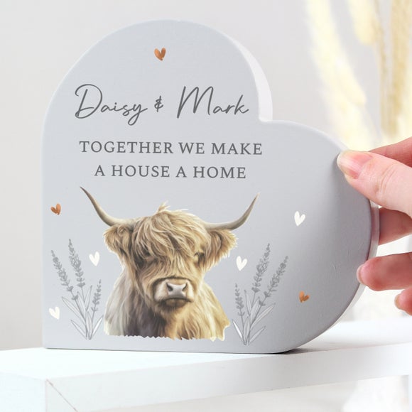 Click to view product details and reviews for Personalised Highland Cow Wooden Heart Ornament.