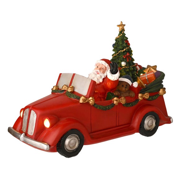 Click to view product details and reviews for The Christmas Gift Co Regal Tidings Light Up Santa Car With Rotating Tree.