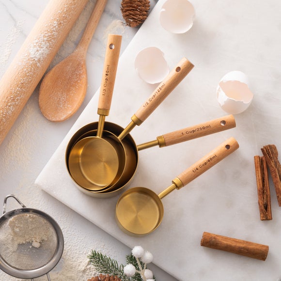View Set Of 4 Gold Measuring Cups View Set Of 4 Gold Measuring Cups