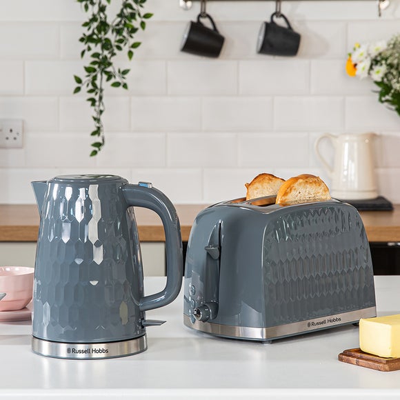 Grey kettle and outlet toaster next