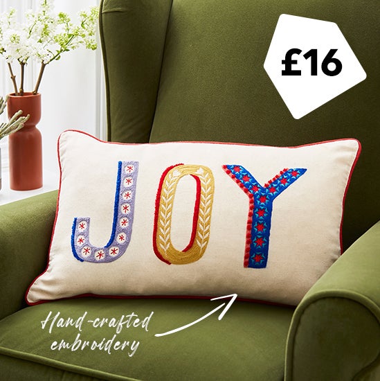 Joy embroidered cushion